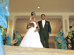 Kenenisa Bekele and his bride after the wedding - Photo source: Daily Telegraph